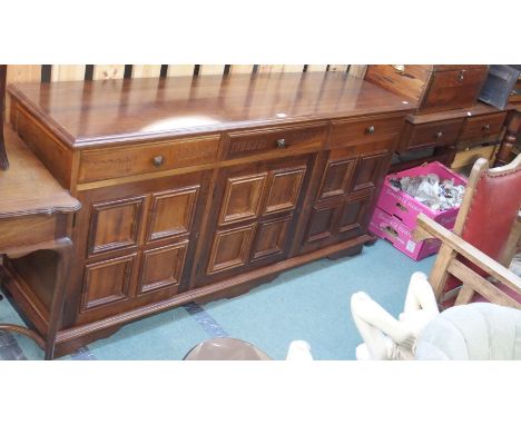 A reproduction mahogany sideboard with three drawers over three panel doors 85cm high x 175cm wide and a matching buffet (2) 