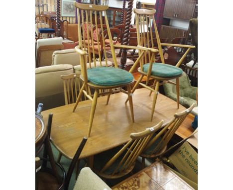 A Ercol dining table, 72cm high x 150cm wide x 77cm wide with two Goldsmith carvers and four chairs (7) Condition Report: Ava