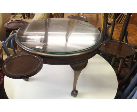 A circular occasional table with ball and claw feet Condition Report: Available upon request