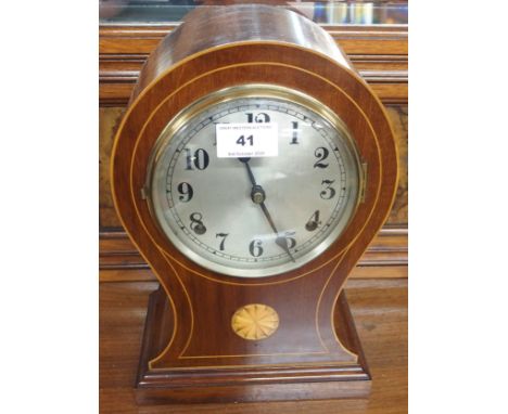 A mahogany inlaid mantle clock and an oak barometer (2) Condition Report: Available upon request