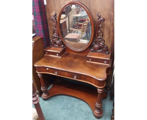 A Victorian mahogany dressing table with oval mirror, 153cm high x 112cm wide Condition Report: Available upon request