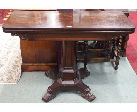 A Victorian rosewood fold over tea table on pedestal base Condition Report: Available upon request