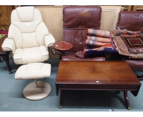 A cream vinyl swivel chair with matching stool and a mahogany coffee table (3) Condition Report: Available upon request