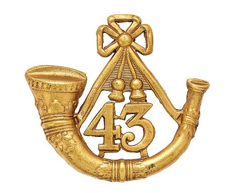 Welsh. 43rd (Monmouthshire Light Infantry) Regiment  glengarry badge circa 1874-81.  Die-stamped brass strung bugle with 43 l