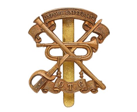 Oxford University OTC Cavalry Section brass cap badge.  Die-stamped crossed sword and scabbard between title scrolls, central