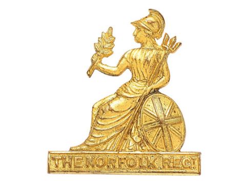 Norfolk Regiment Officer gilt cap badge circa 1900-35.  Good die-cast gilt figure of seated Britannia with Union shield and t
