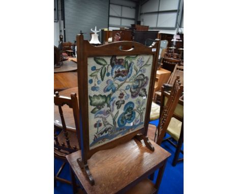 An early 20th Century mahogany framed tapestry firescreen