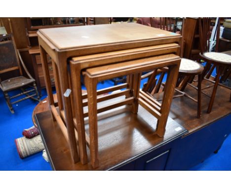 An Arts and Crafts golden oak nest of three tables, bearing marks for Stanley Webb Davies number or date mark 1957
Small tabl