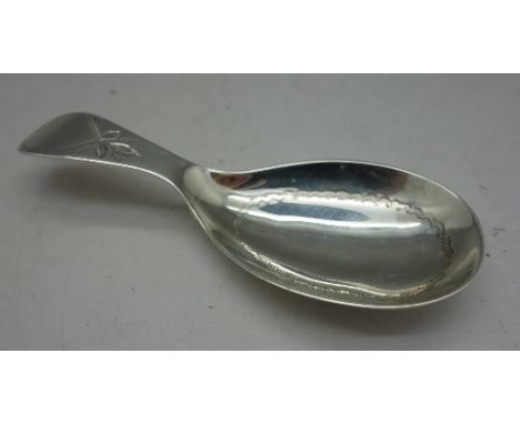 A silver caddy spoon by George Unite, Birmingham 1911