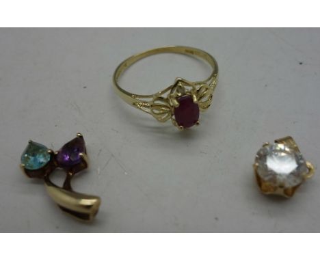 A 9ct gold and ruby ring and two 9ct gold pendants, total weight 2.5g, ring size O