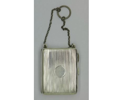 A lady's silver combination compact/cigarette case/vesta case with chain handle, Birmingham 1945, 74 x 58mm