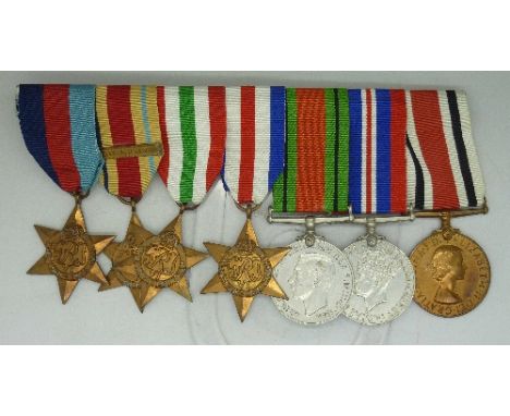 A group of six unnamed WWII medals including The Africa Star with 8th Army bar, The Italy Star and The France and Germany Sta