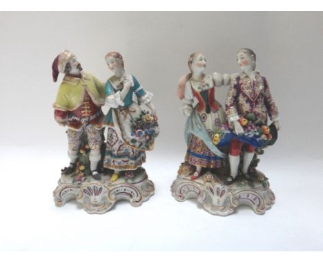 A group of twelve Continental porcelain figures, early 20th century; also a pair of porcelain sheep and a pipe bowl. 