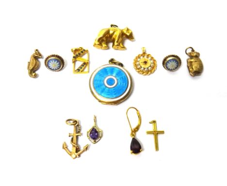 A pale blue and white enamelled circular pendant locket, detailed 935, a gold and sapphire set pendant, detailed 18 K, seven 