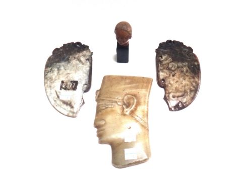 Two Chinese hardstone cutting blades of archaic style, 17.7cm, an alabaster carved wall plaque depicting the head of an Egypt