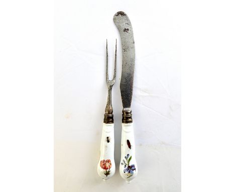 A pair of Meissen porcelain cutlery handles, mid-18th century, each painted with flowers and insects, attached to a steel two