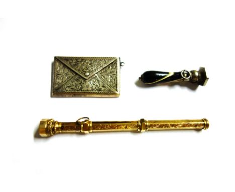 A Victorian gold cased slide action dip pen cum pencil, of hexagonal form with engraved decoration and having a cornelian fin