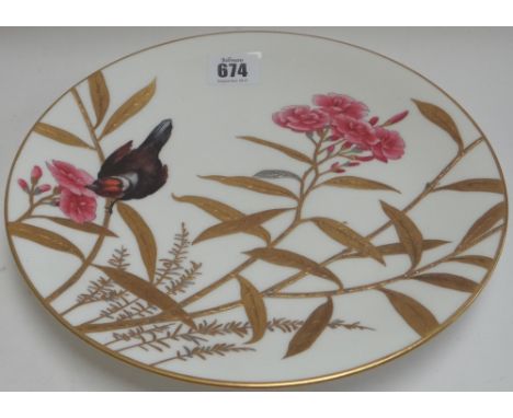 A Minton porcelain plate, late 19th century, decorated with a bird in branches with raised silvering and gilt, puce printed a