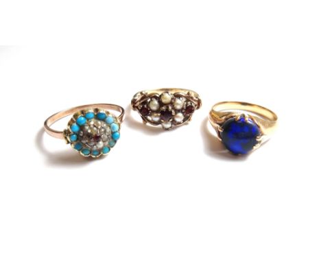 A gold and opal set single stone ring, a 9ct gold, garnet and half pearl set cluster ring and a gold, turquoise and gem set c