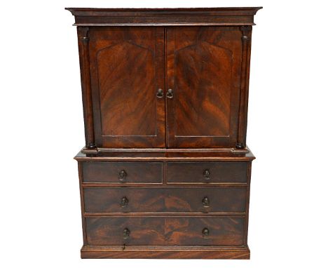 An early 19th century style miniature mahogany linen press, with pair of panel doors over two short and two long drawers, on 