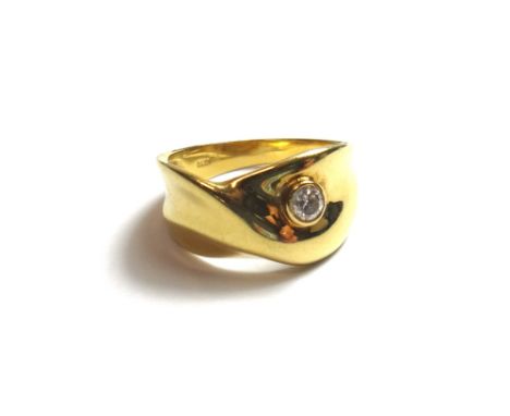 A gold and diamond set ring, in an abstract design, collect set with a circular cut diamond, detailed 0.10 K 18, ring size L,