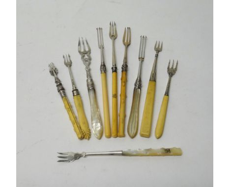 A Victorian silver pickle fork, with engraved decoration and having a mother of pearl handle, Birmingham 1862, a Victorian si