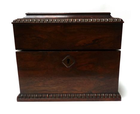 A William IV rosewood decanter box with split bobbin decoration, including three decanters, 27cm wide. 