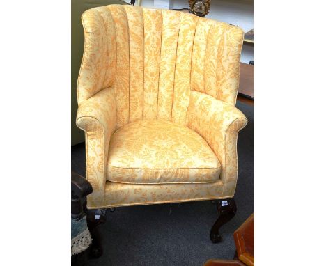 An 18th century style tub back armchair on acanthus capped cabriole supports, on ball and claw feet.