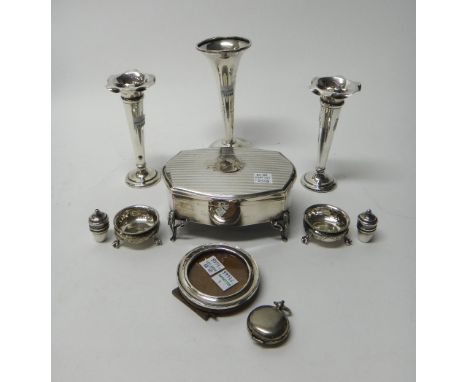 Silver and silver mounted wares, comprising; a shaped oval hinge lidded dressing table trinket box, raised on four feet, Birm