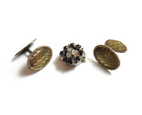 A gold, diamond and sapphire set snap clasp, in a pierced design, detailed 585 and a pair of dress cufflinks, having engine t