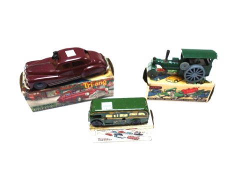 A Triang Minic clockwork steam roller, boxed, a Triang Minic no.2 police car, and a Brimtoy mechanical green line bus, boxed 