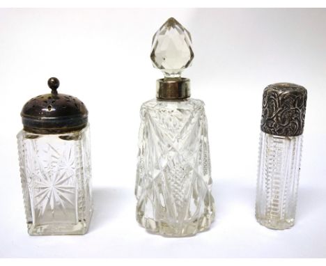 A Victorian silver topped facet cut glass smelling salts bottle, London 1895, a silver mounted glass scent bottle, Birmingham