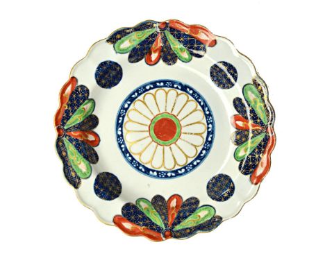 A Worcester fluted dessert plate, circa 1765, painted with the `Old Japan Fan' pattern, pseudo Oriental marks, 19cm diameter.