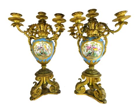 A pair of French ormolu mounted Sevres style porcelain five light candelabra, late 19th century, each with turquoise ground v