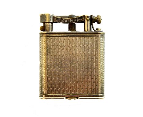 A silver plated Dunhill petrol lighter, of curved rectangular form, with engine turned decoration, detailed Pat.No 390107, Ma