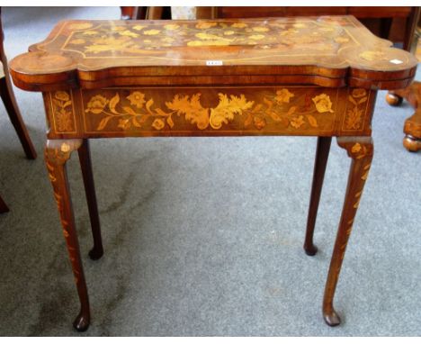 An 18th century marquetry inlaid Dutch walnut card table, with shaped top on slender cabriole supports, 83cm wide.