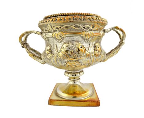 A silver model of a twin handled classical vase, the body decorated with vine leaves, bunches of grapes and with classical Ba