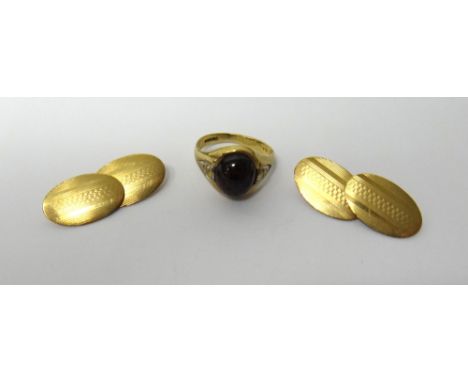 A pair of 9ct gold oval cufflinks, with engine turned decoration, Birmingham 1944, weight 5.8 gms and a 9ct gold ring, mounte
