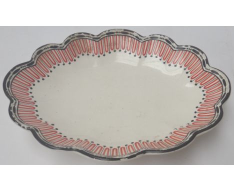 A group of English creamware, mostly late 18th century, comprising; two trembleuse stands in the form of a scallop shell with