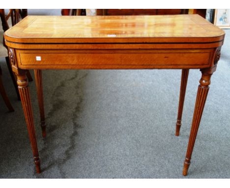 A mid 18th century style mahogany banded satinwood card table on tapering reeded supports, 92cm wide.