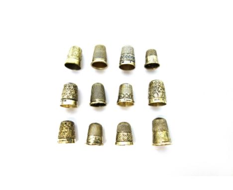 A silver thimble, Birmingham 1905, six further silver thimbles and five further thimbles in a variety of designs. 