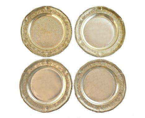 Four George III silver shaped circular plates, bearing the mark of Fogelberg & Gilbert, London 1792, with gadrooned borders, 