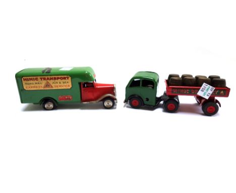 Five Triang Minic clockwork vehicles, comprising; a flatbed wagon, a Shell BP fuel oil tanker, a Luton transport lorry, a BP 