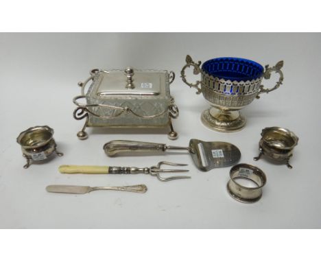 A pair of silver salts, each raised on three feet, Sheffield 1900, a silver napkin ring, Birmingham 1923, a European steel bl