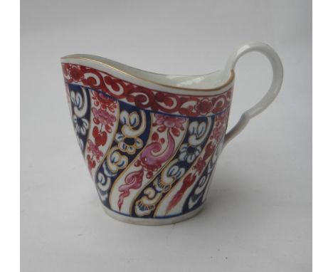 A Worcester shaped oval milk jug, circa 1770, painted with the `Queen Charlotte' pattern, blue open crescent mark, 9cm.high.
