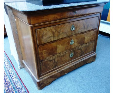 An early 19th century French commode, the marble top over a flame mahogany four drawer base, 112cm wide.