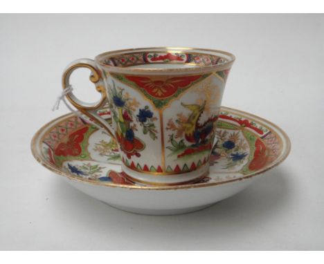 A Chamberlain Worcester coffee cup and saucer, circa 1805, painted with the `Dragons in Compartments' pattern, red painted pa