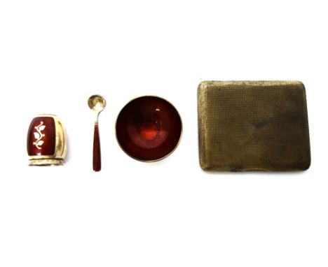 A Danish Sterling silver and red enamelled condiment set, comprising; a circular salt with a spoon and a pepperette detailed 
