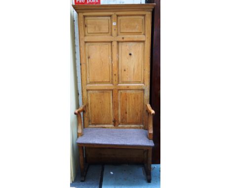 A 19th century pine open arm hall bench with high six panel back, 90cm wide x 193cm high. 