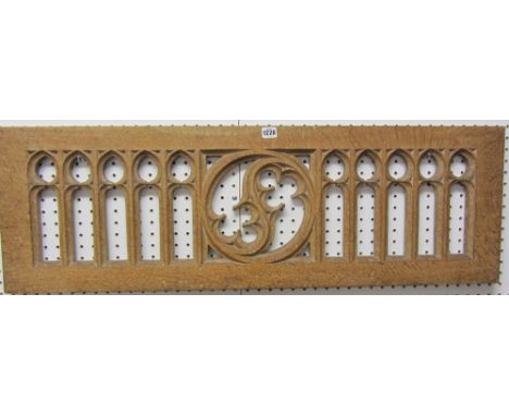 A Victorian carved oak Gothic Revival pierced panel of interlocking arches centred by a quatrefoil pierced roundel, 107cm x 3